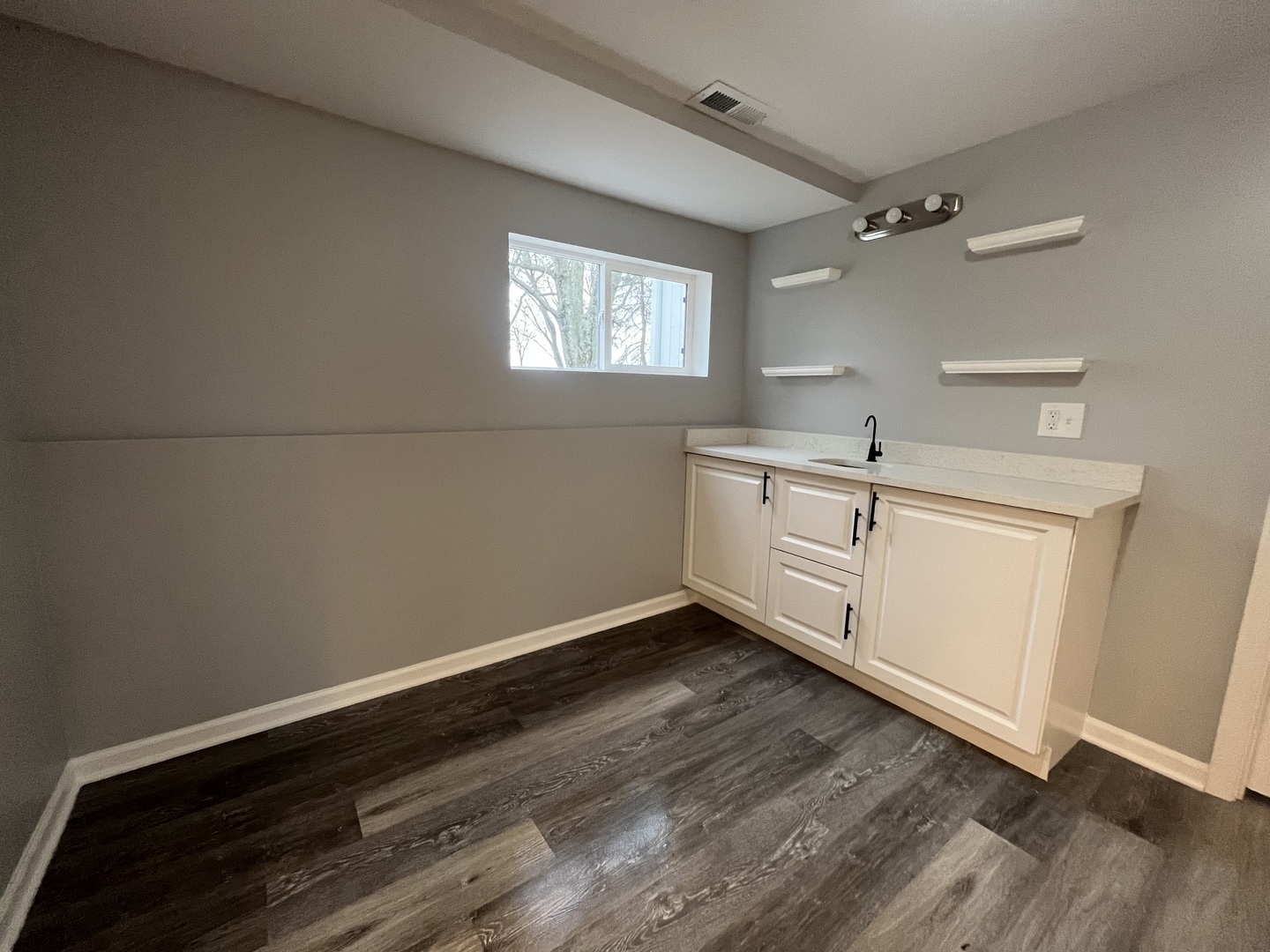 46 North 46th Road Mendota, IL 61342 - Photo 29 of 48 a room with a white cabinets and wooden floor