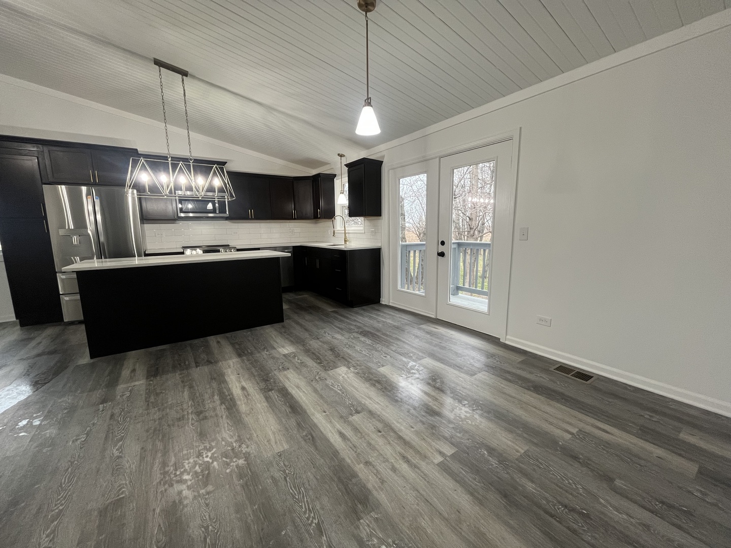 46 North 46th Road Mendota, IL 61342 - Photo 3 of 48 a large kitchen with a chandelier