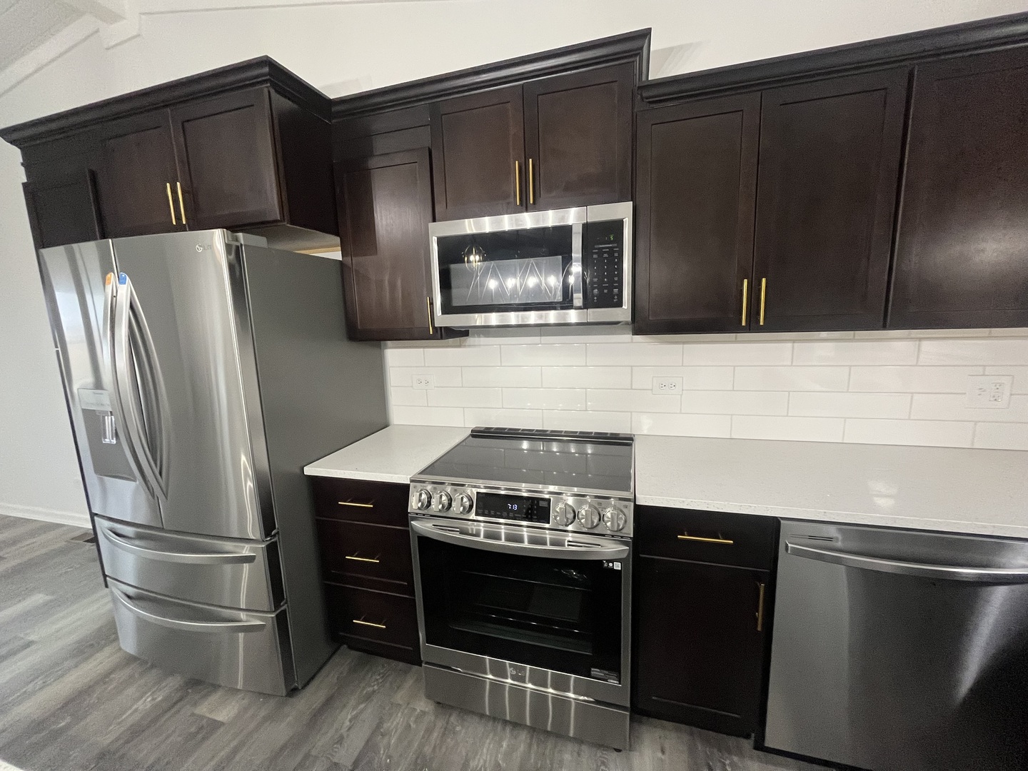 46 North 46th Road Mendota, IL 61342 - Photo 4 of 48 a kitchen with granite countertop a refrigerator stove and microwave