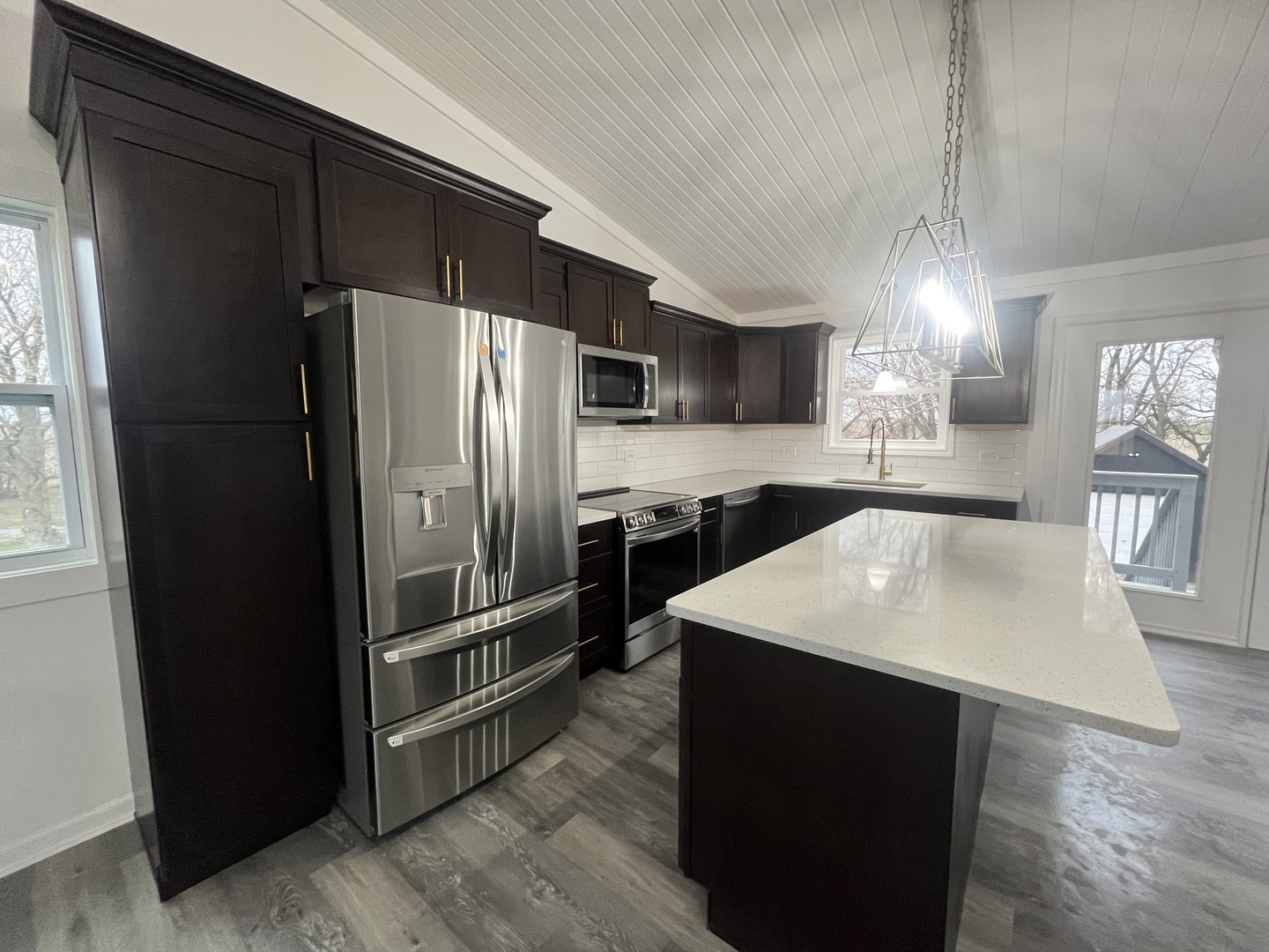 46 North 46th Road Mendota, IL 61342 - Photo 7 of 48 a kitchen with stainless steel appliances a refrigerator and a stove top oven