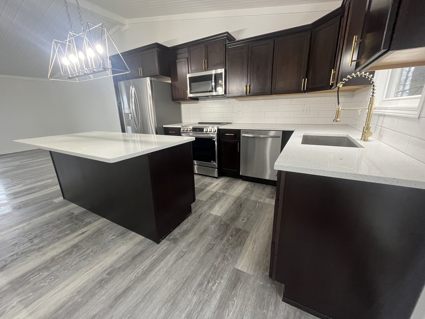46 North 46th Road Mendota, IL 61342 - Photo 8 of 48 a kitchen with stainless steel appliances a sink a stove a refrigerator and cabinets