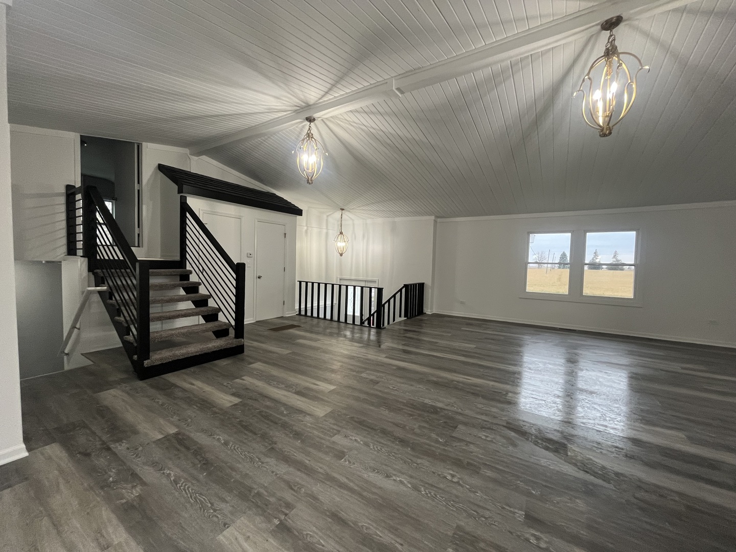46 North 46th Road Mendota, IL 61342 - Photo 9 of 48 a view of an empty room with wooden floor and staircase