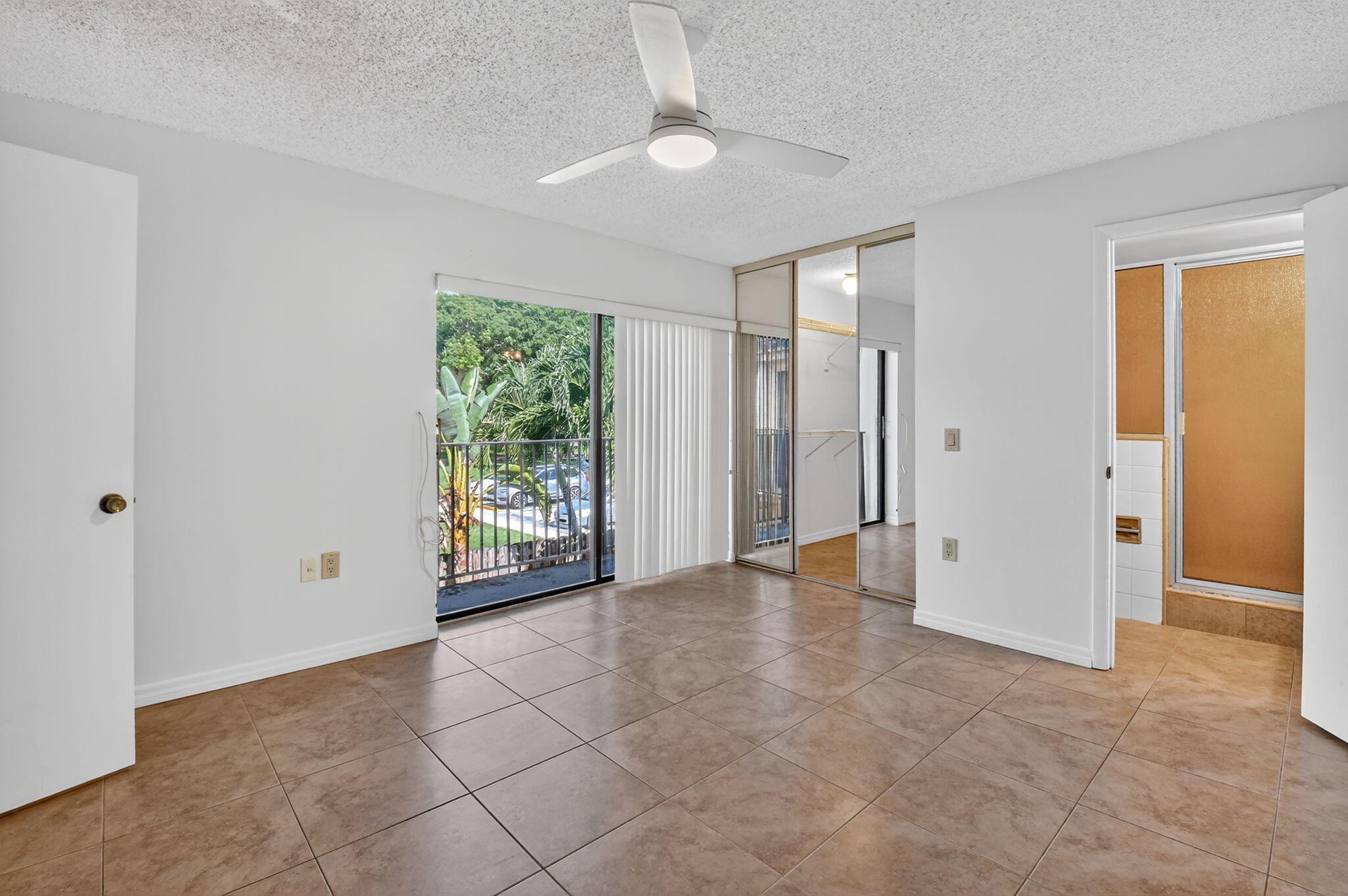 2907 Southwest 22nd Circle, Unit 39D Delray Beach, FL 33445 - Photo 18 of 57 an empty room with windows and closet