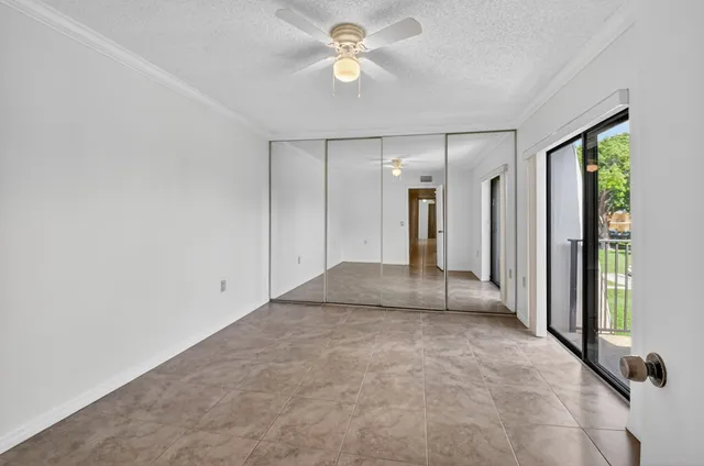 a view of a house with wooden fence