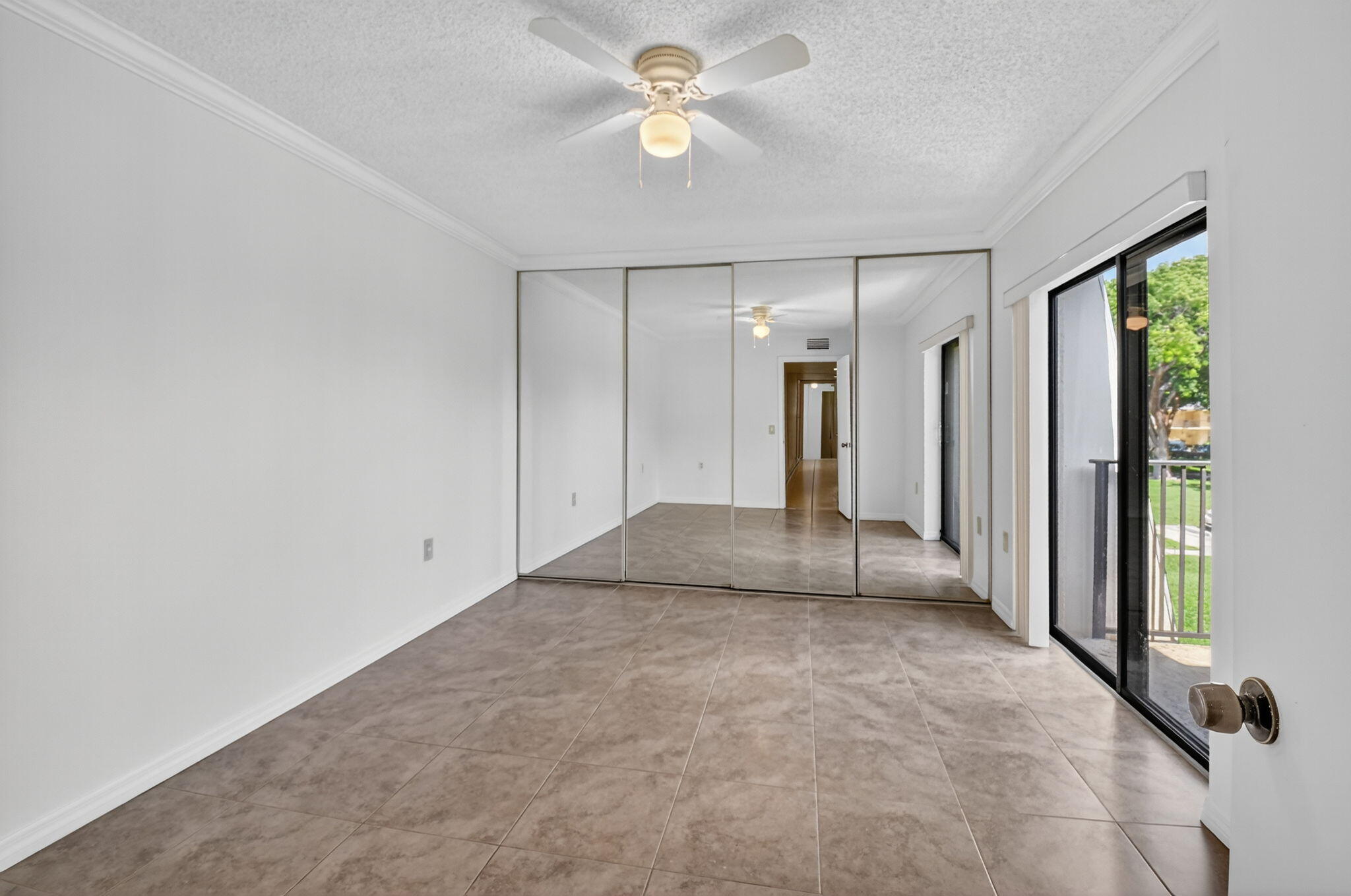 2907 Southwest 22nd Circle, Unit 39D Delray Beach, FL 33445 - Photo 22 of 57 an empty room with closet and a chandelier fan