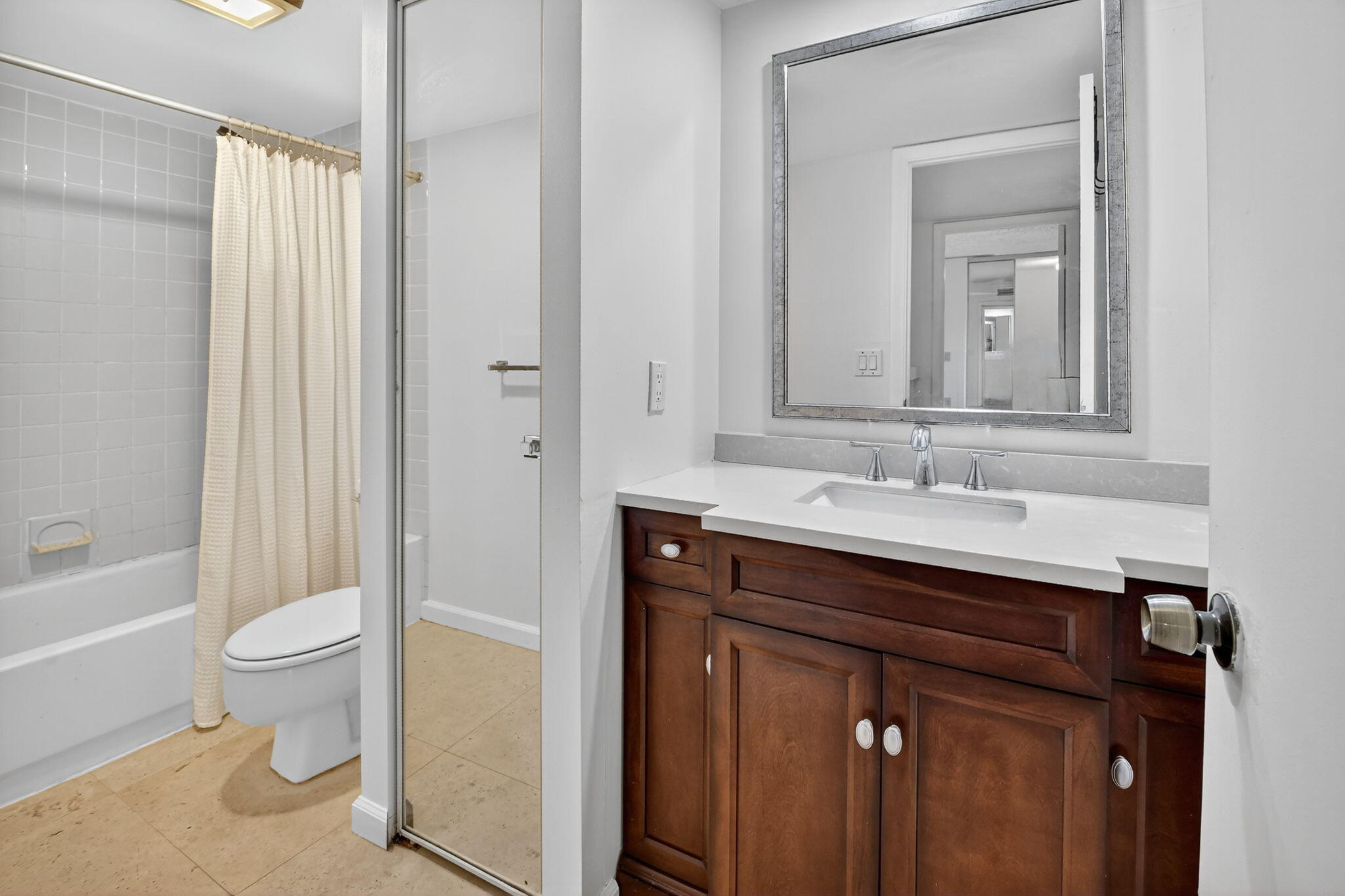 2907 Southwest 22nd Circle, Unit 39D Delray Beach, FL 33445 - Photo 25 of 57 a bathroom with a sink a toilet and shower