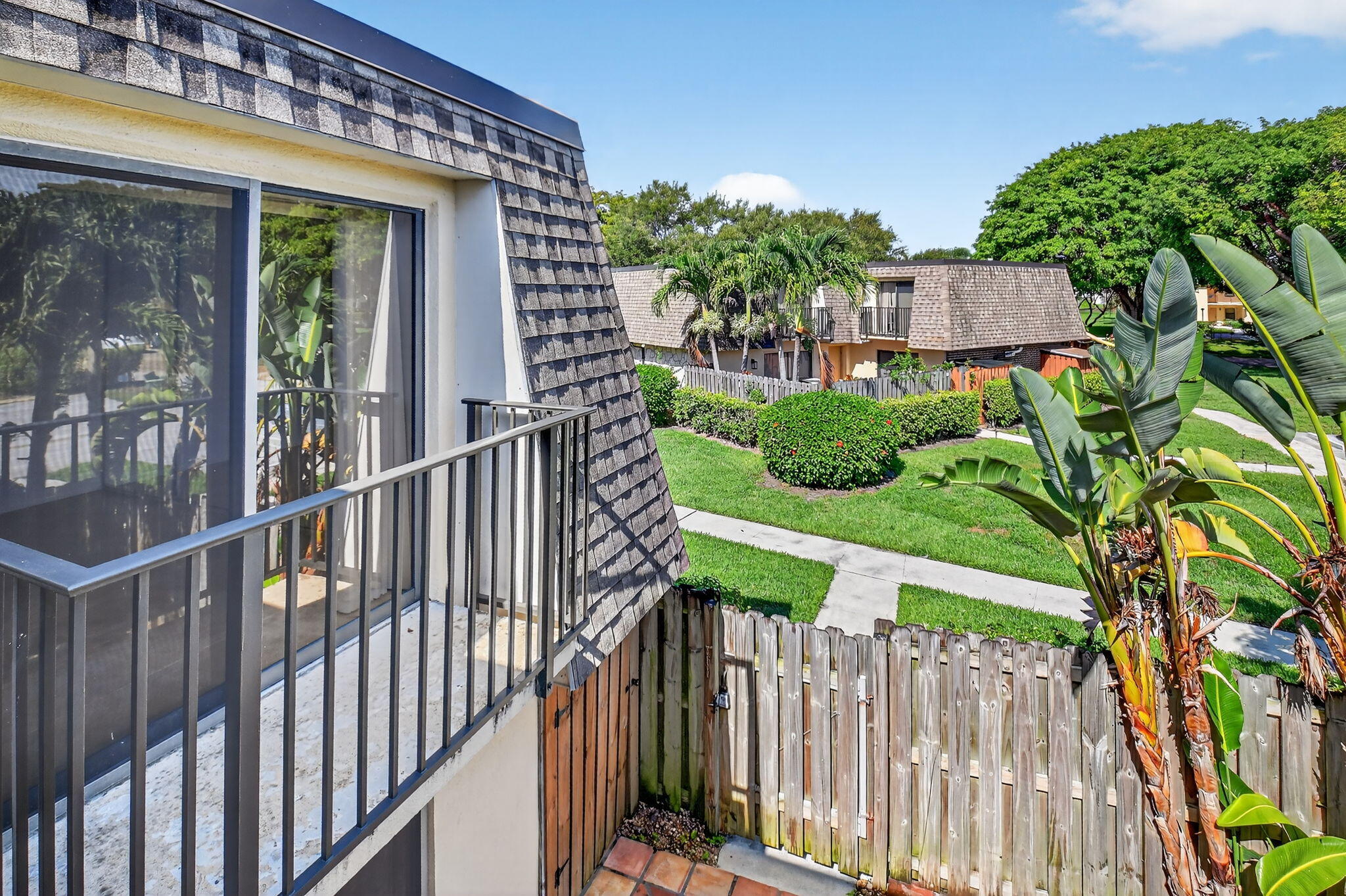 2907 Southwest 22nd Circle, Unit 39D Delray Beach, FL 33445 - Photo 26 of 57 a view of a house with wooden fence