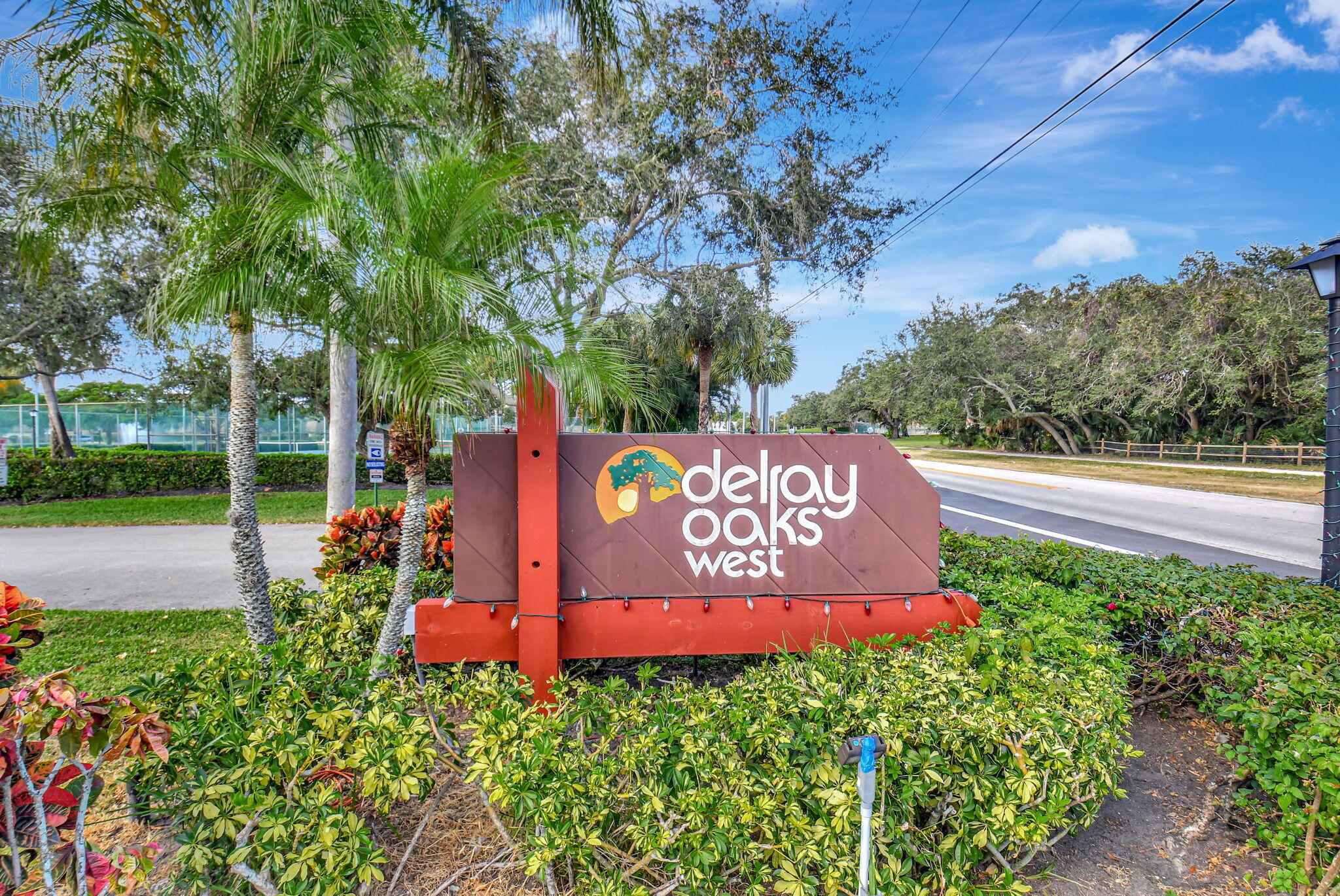 2907 Southwest 22nd Circle, Unit 39D Delray Beach, FL 33445 - Photo 36 of 57 a sign on the side of the road