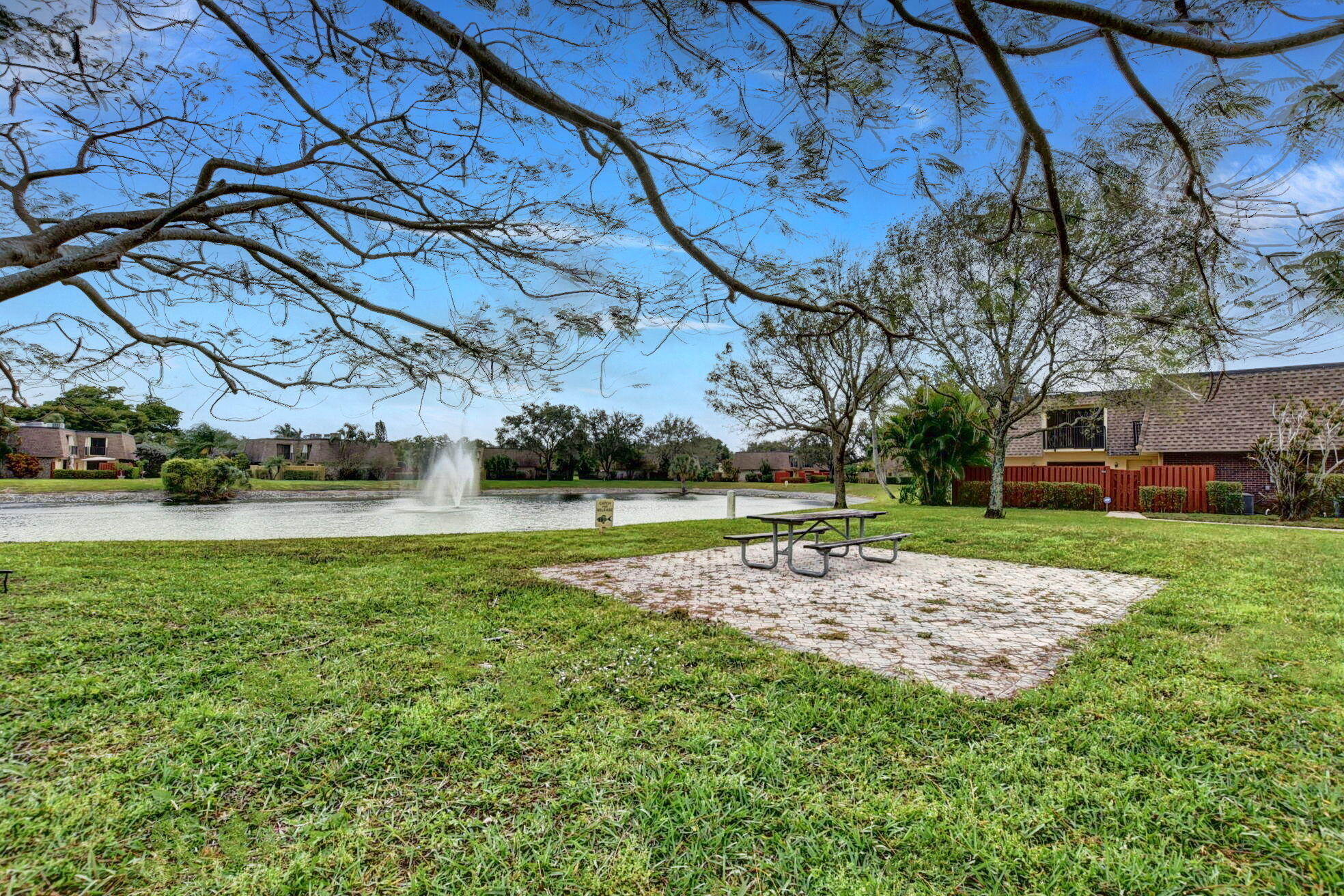 2907 Southwest 22nd Circle, Unit 39D Delray Beach, FL 33445 - Photo 37 of 57 a view of a fountain in front of a house