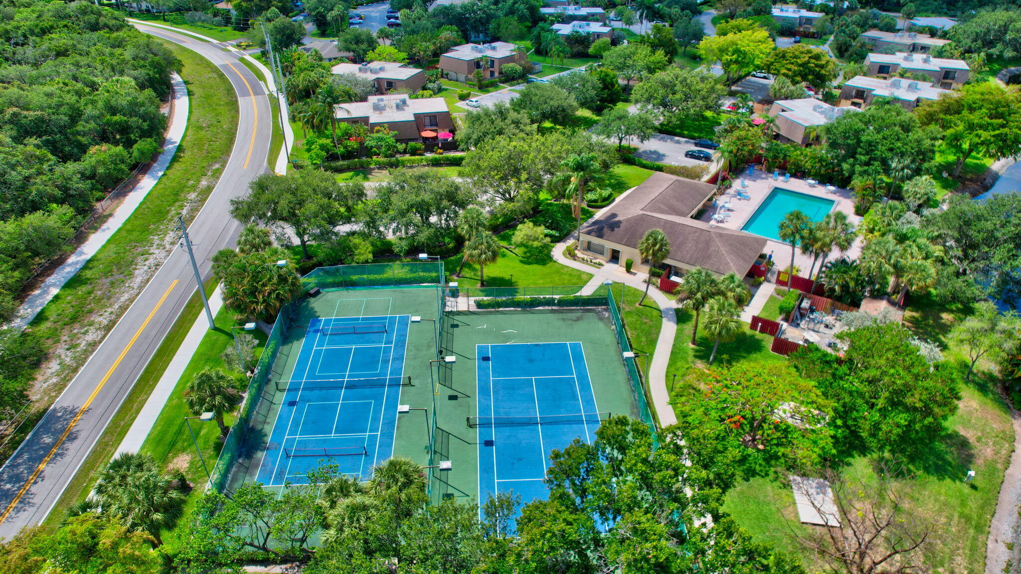 2907 Southwest 22nd Circle, Unit 39D Delray Beach, FL 33445 - Photo 40 of 57 an aerial view of multiple houses with yard