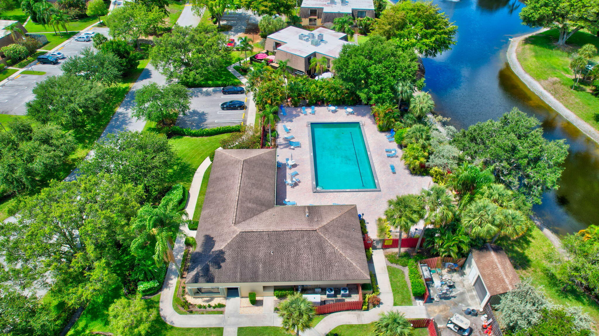 2907 Southwest 22nd Circle, Unit 39D Delray Beach, FL 33445 - Photo 42 of 57 an aerial view of a house with a garden and swimming pool