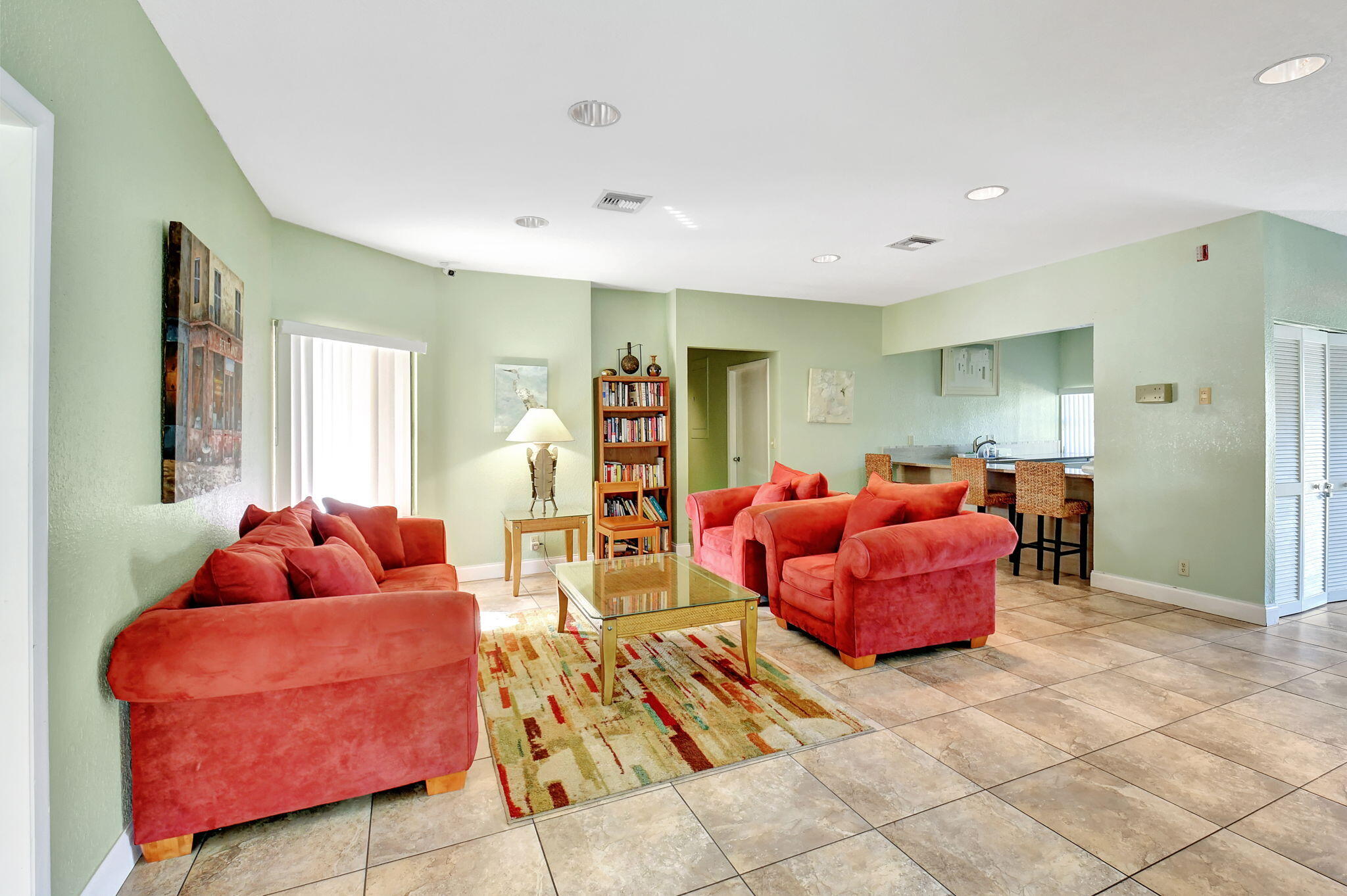 2907 Southwest 22nd Circle, Unit 39D Delray Beach, FL 33445 - Photo 44 of 57 a living room with furniture and many windows