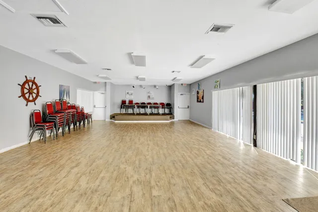 an aerial view of a house with a yard and a fountain