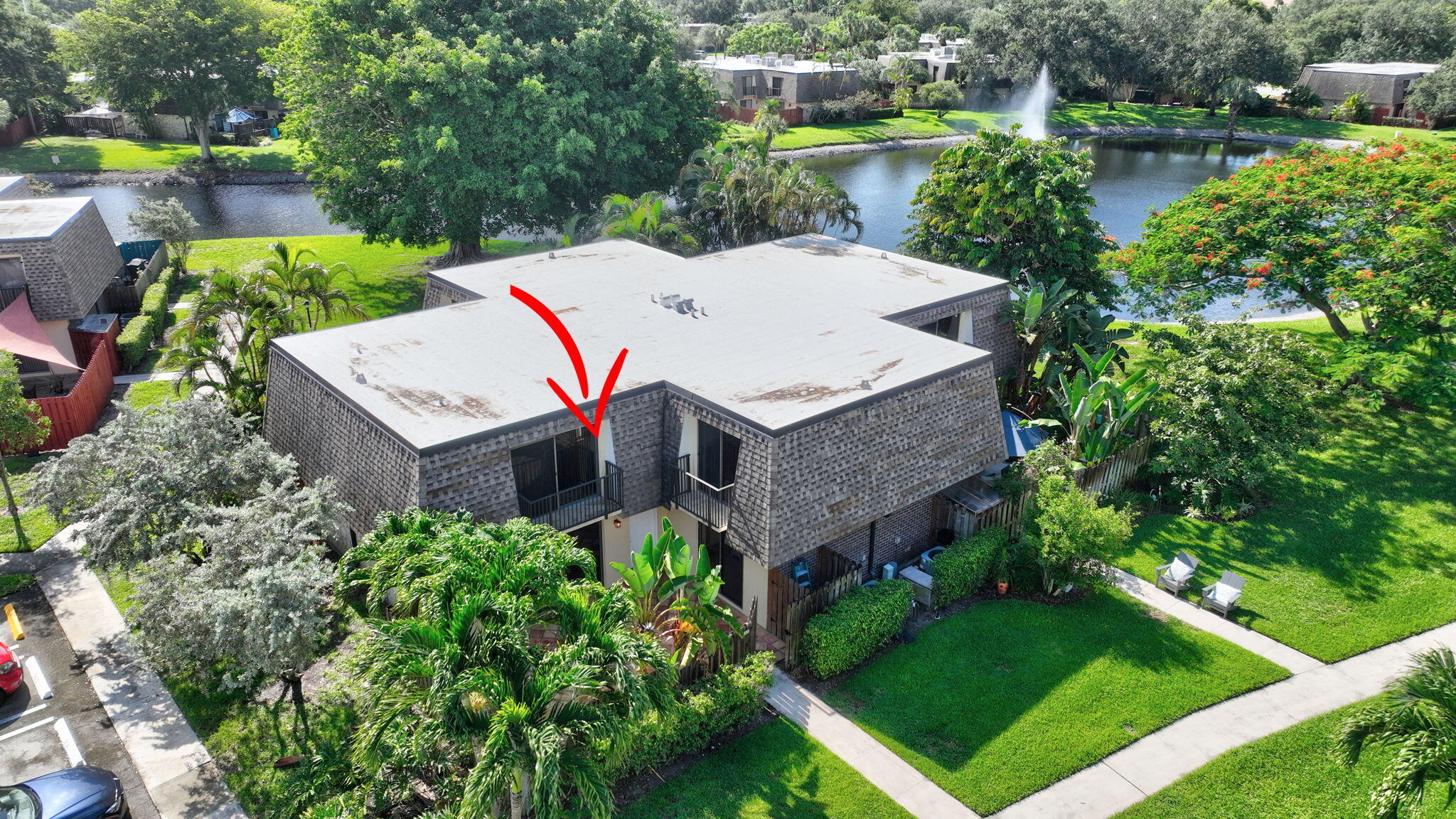 2907 Southwest 22nd Circle, Unit 39D Delray Beach, FL 33445 - Photo 51 of 57 an aerial view of a house with a garden and plants