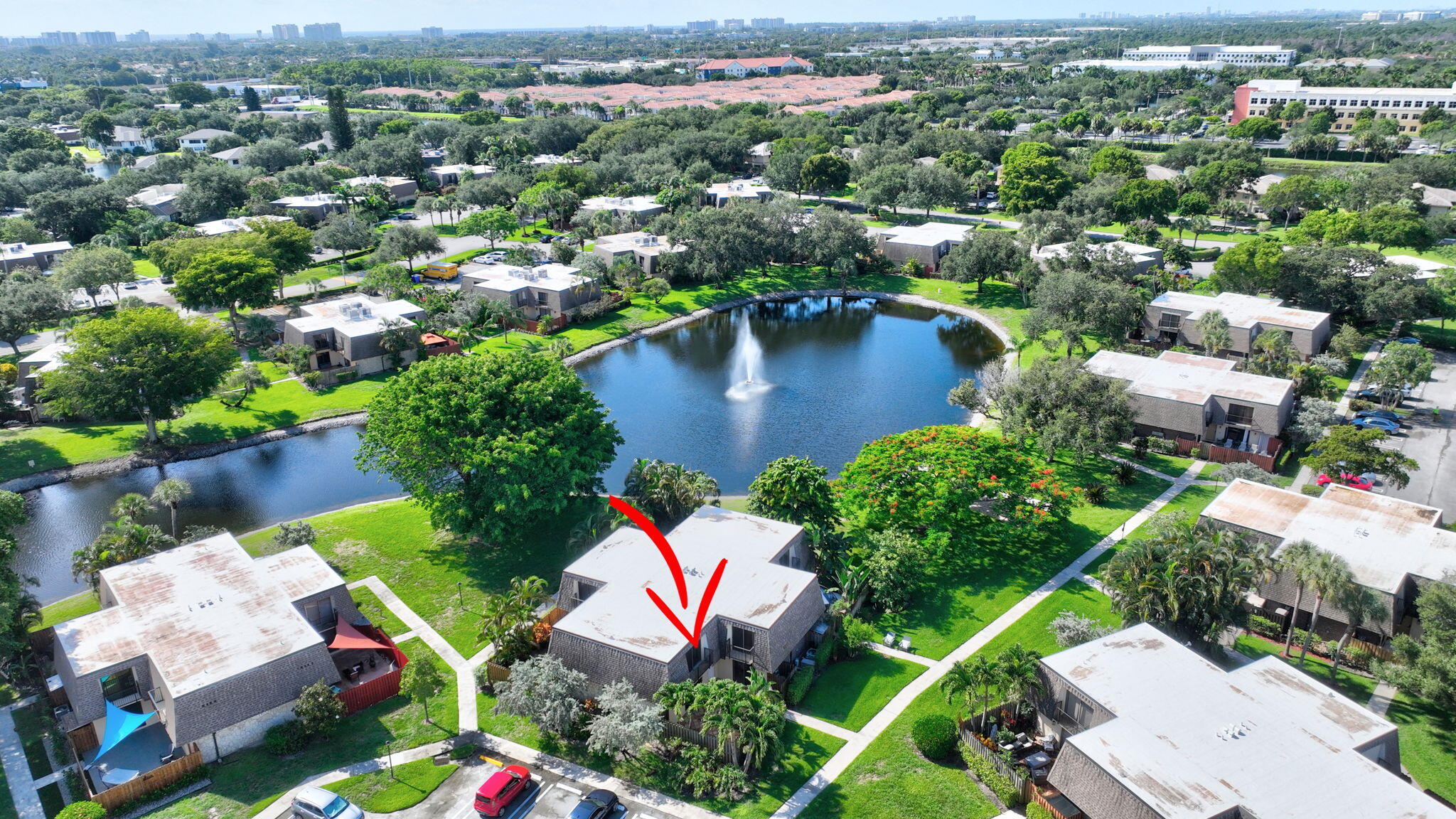 2907 Southwest 22nd Circle, Unit 39D Delray Beach, FL 33445 - Photo 54 of 57 an aerial view of a houses with a lake view
