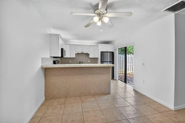 a view of a hallway with closet and entryway