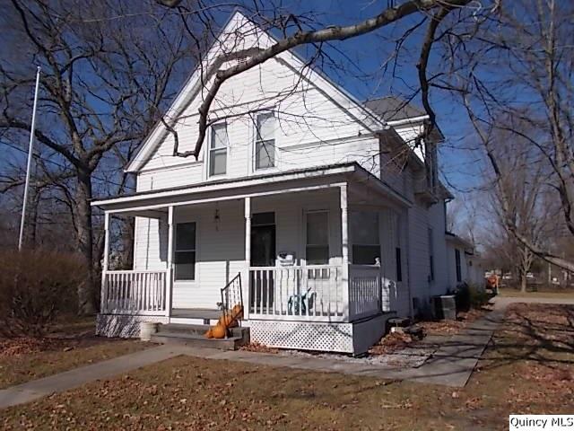 311 Buchanan Street Carthage, IL 62321 - Photo 1 of 1 a front view of a house with a tree