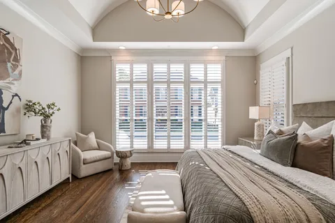 a bedroom with a bed and a couch