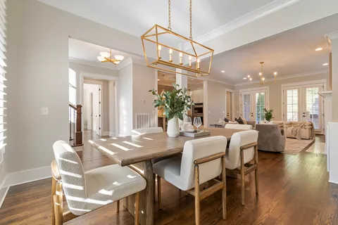 a living room with fireplace furniture and a wooden floor