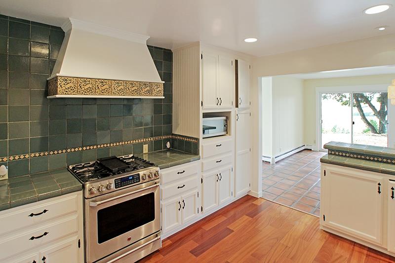 33 Langley Hill Road Woodside, CA 94062 - Photo 13 of 53 a kitchen with stainless steel appliances granite countertop a stove a sink and a refrigerator