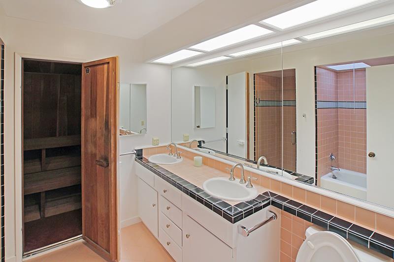 33 Langley Hill Road Woodside, CA 94062 - Photo 25 of 53 a bathroom with a granite countertop sink and a mirror