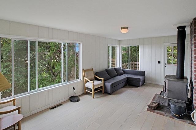 a kitchen with a stove a refrigerator and a sink