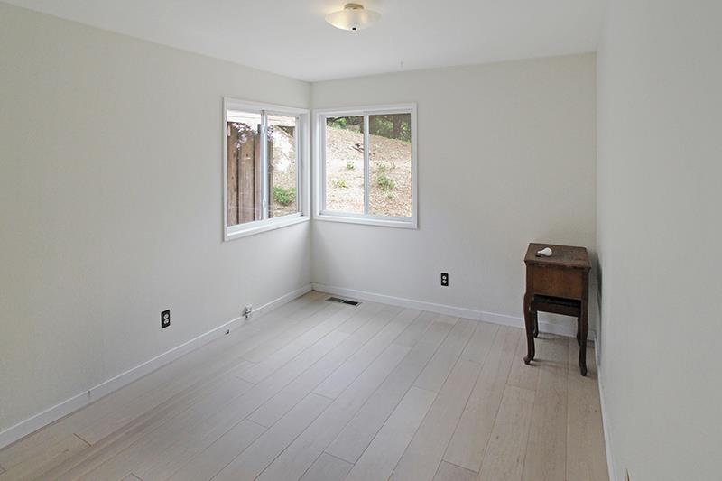 33 Langley Hill Road Woodside, CA 94062 - Photo 34 of 53 an empty room with a window and wooden floor