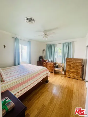 a bedroom with a bed and dresser