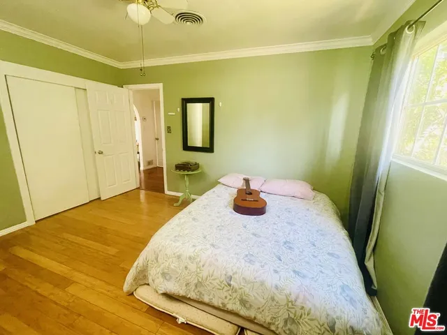 a bedroom with a bed and a table