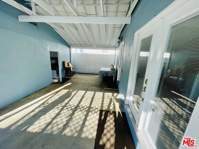 a view of a hallway with washer and dryer