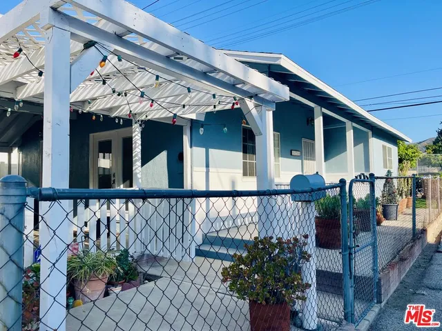 a view of a balcony with wooden floor