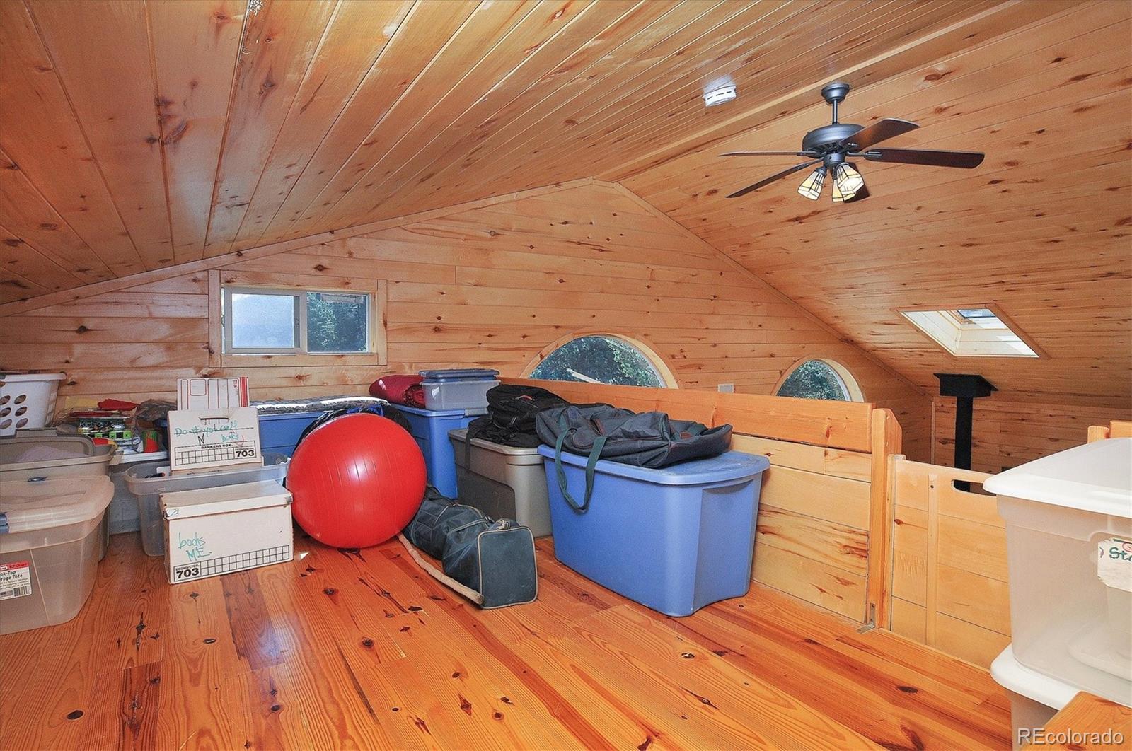 1111 Red Feather Road Cotopaxi, CO 81223 - Photo 24 of 37 a view of a living room and a wooden floor
