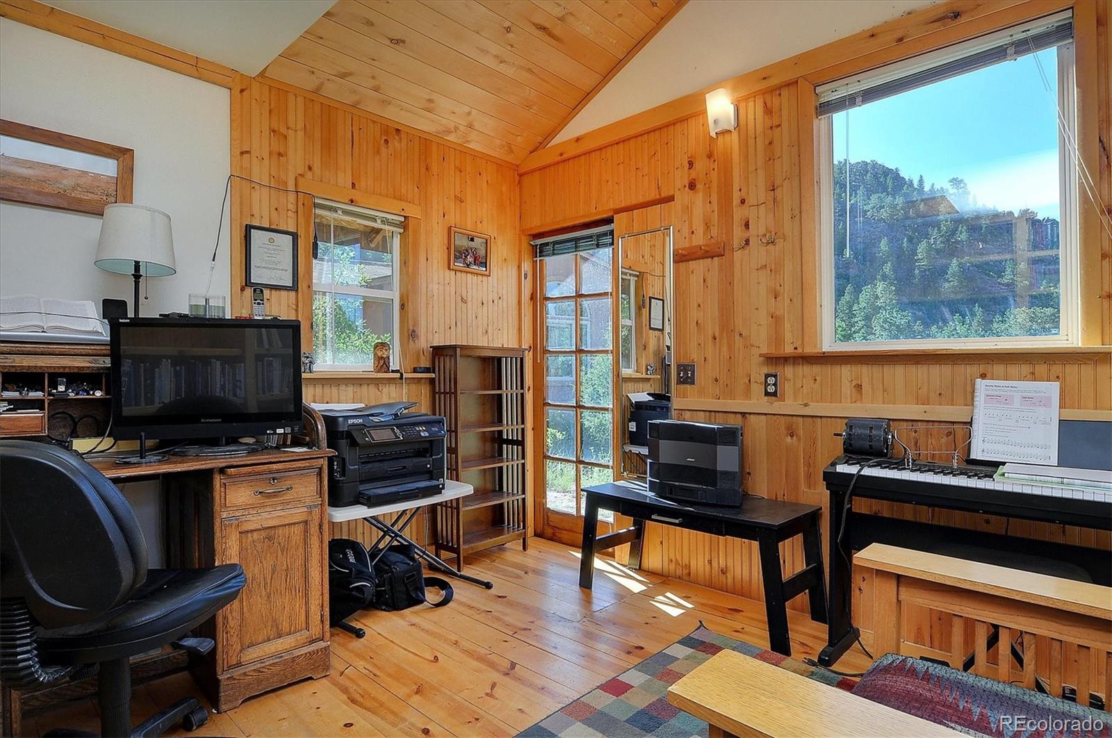 1111 Red Feather Road Cotopaxi, CO 81223 - Photo 29 of 37 a view of a workspace with furniture and a window