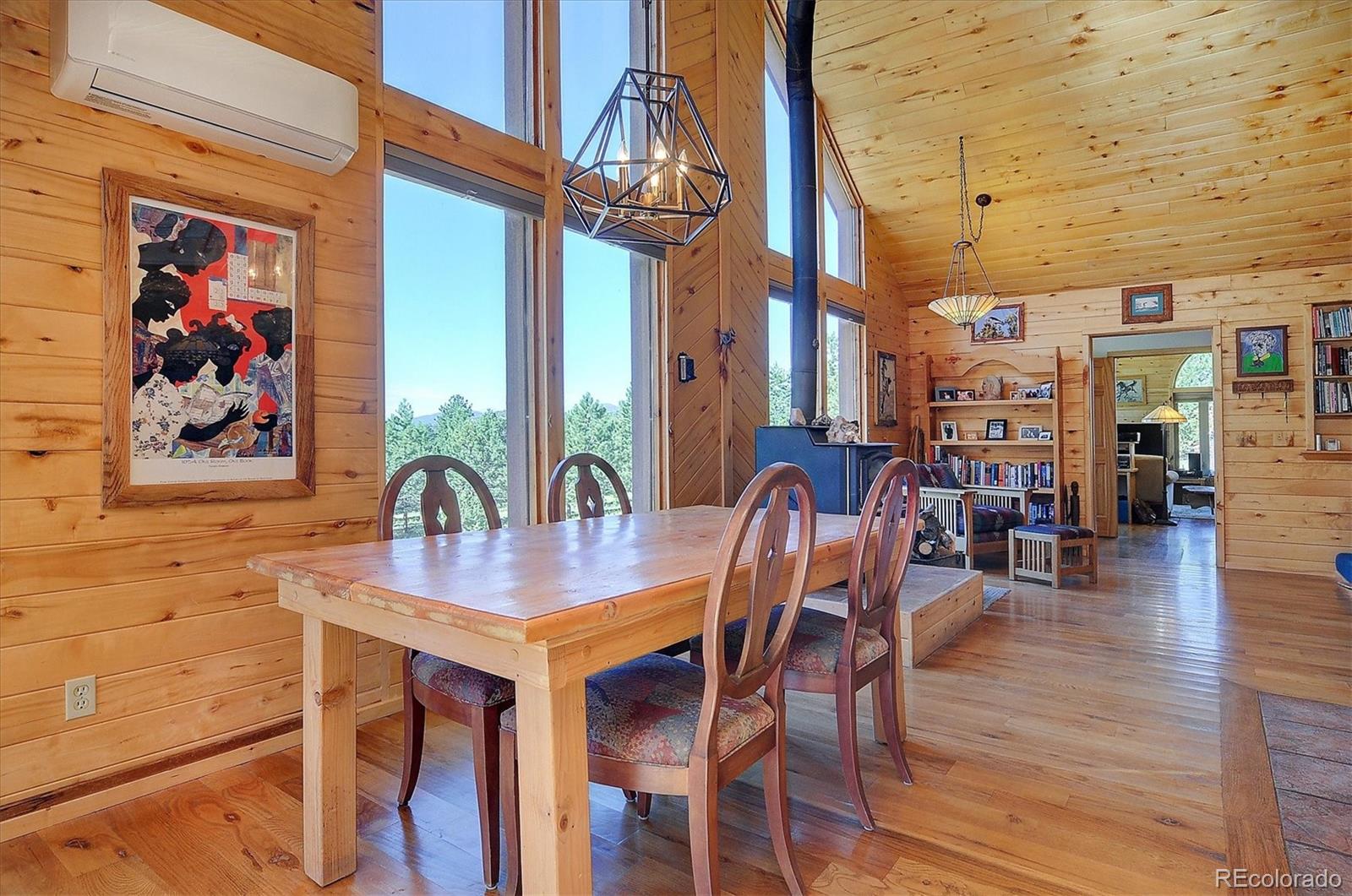 1111 Red Feather Road Cotopaxi, CO 81223 - Photo 8 of 37 a view of a dining room with furniture one side kitchen view and wooden floor