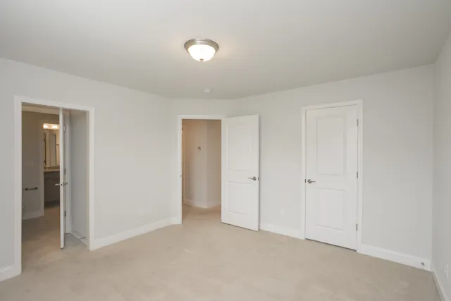 an empty room with closet area