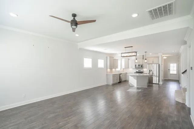 a view of a living room and kitchen view