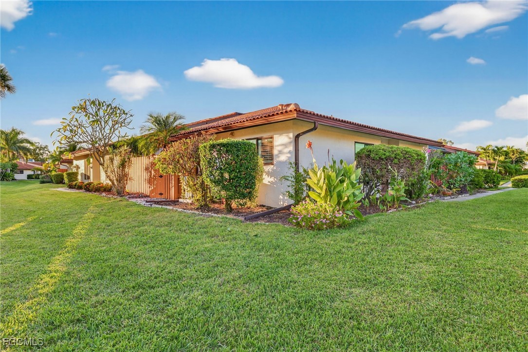 1414 Park Shore Circle, Unit 2 Fort Myers, FL 33901 - Photo 1 of 35 a view of a back yard of the house