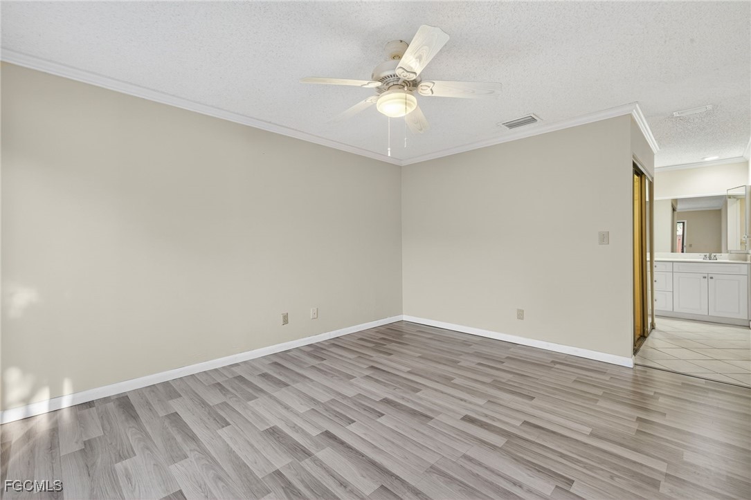 1414 Park Shore Circle, Unit 2 Fort Myers, FL 33901 - Photo 15 of 35 a view of an empty room with wooden floor