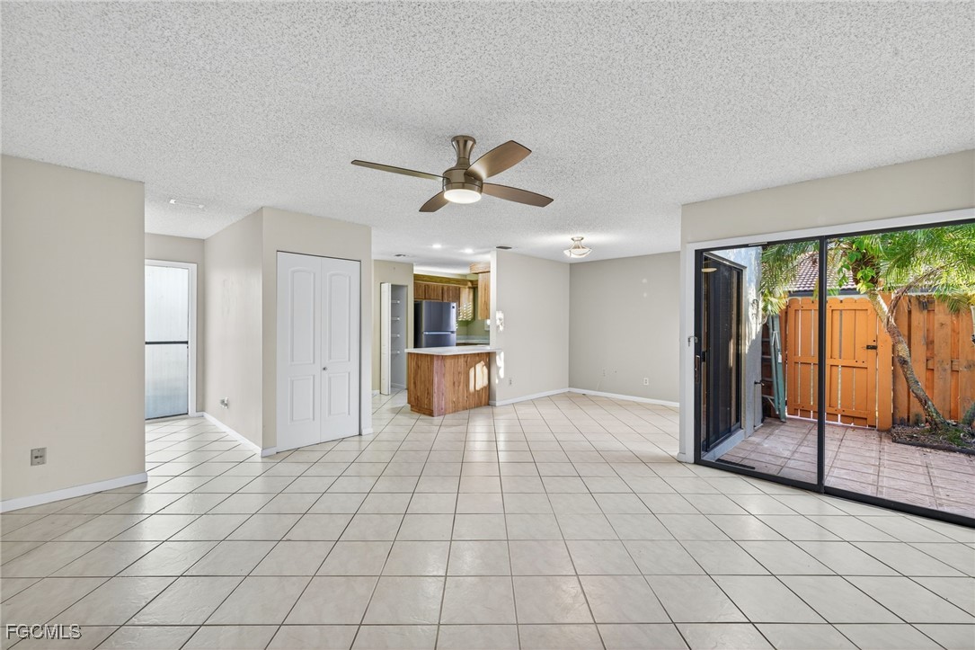1414 Park Shore Circle, Unit 2 Fort Myers, FL 33901 - Photo 7 of 35 a view of a livingroom with a chandelier fan and windows