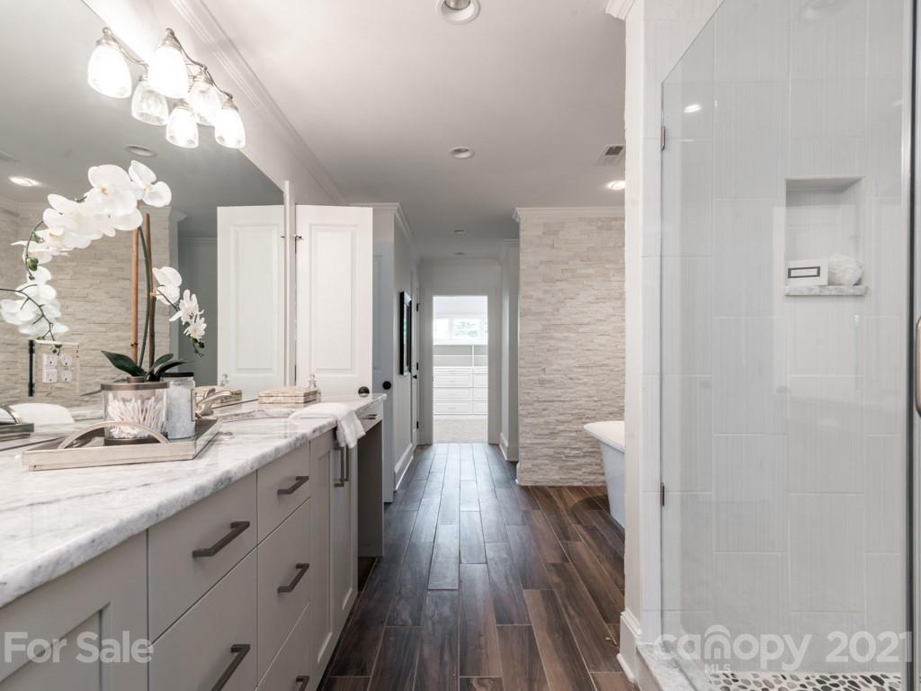 2248 Colony Road Charlotte, NC 28209 - Photo 15 of 27 a bathroom with a double vanity sink and a mirror