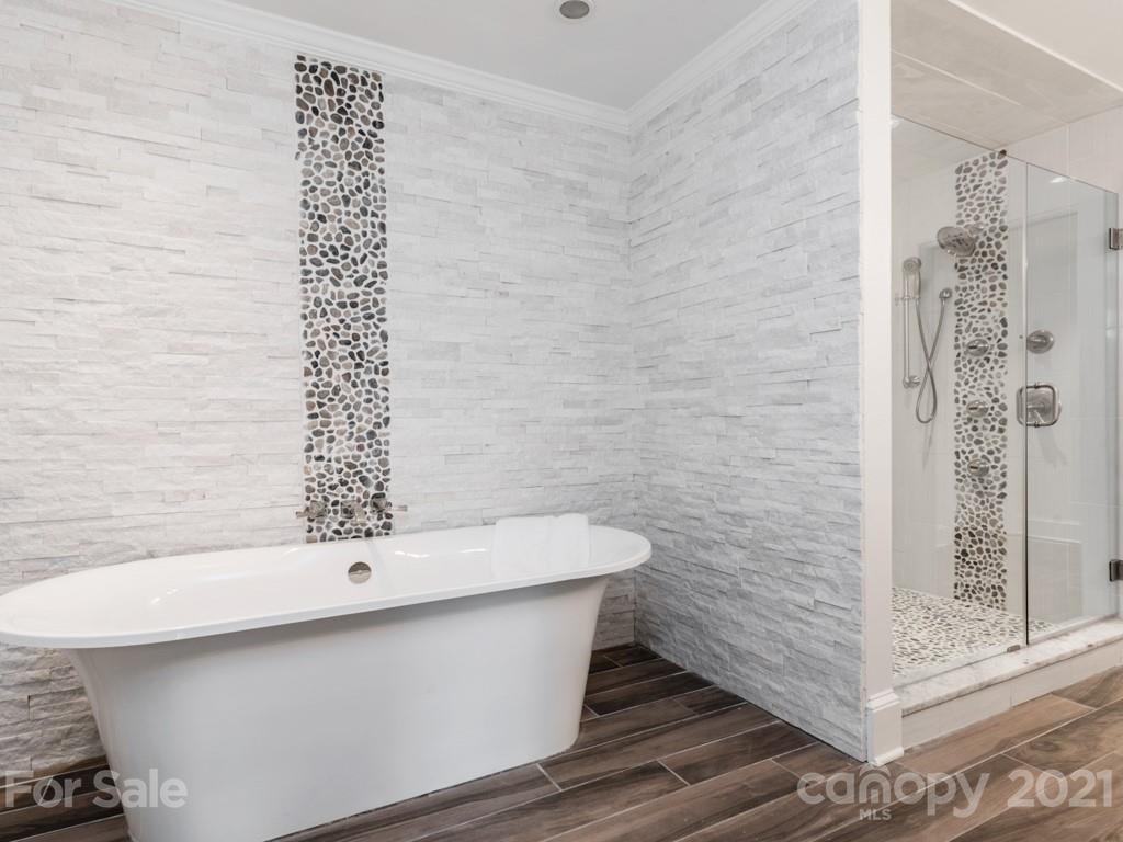 2248 Colony Road Charlotte, NC 28209 - Photo 18 of 27 a bathroom with a bathtub and shower