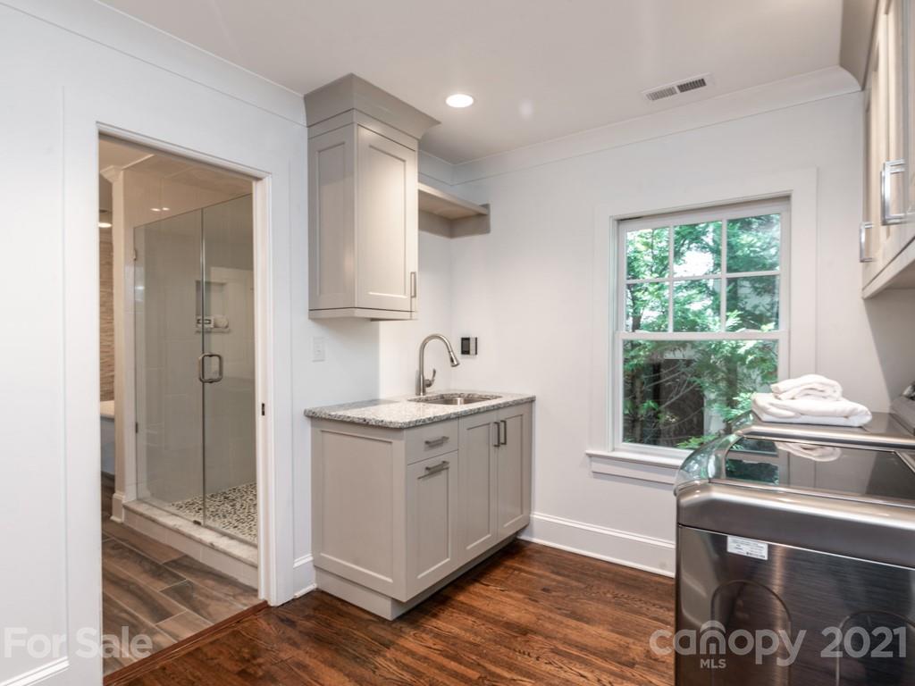 2248 Colony Road Charlotte, NC 28209 - Photo 20 of 27 a kitchen with a sink and wooden floor