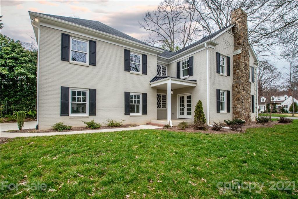 2248 Colony Road Charlotte, NC 28209 - Photo 27 of 27 a front view of a house with a yard and trees