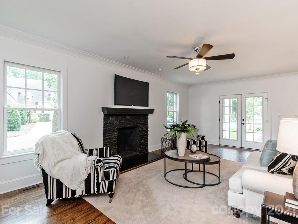 2248 Colony Road Charlotte, NC 28209 - Photo 4 of 27 a living room with furniture and a fireplace