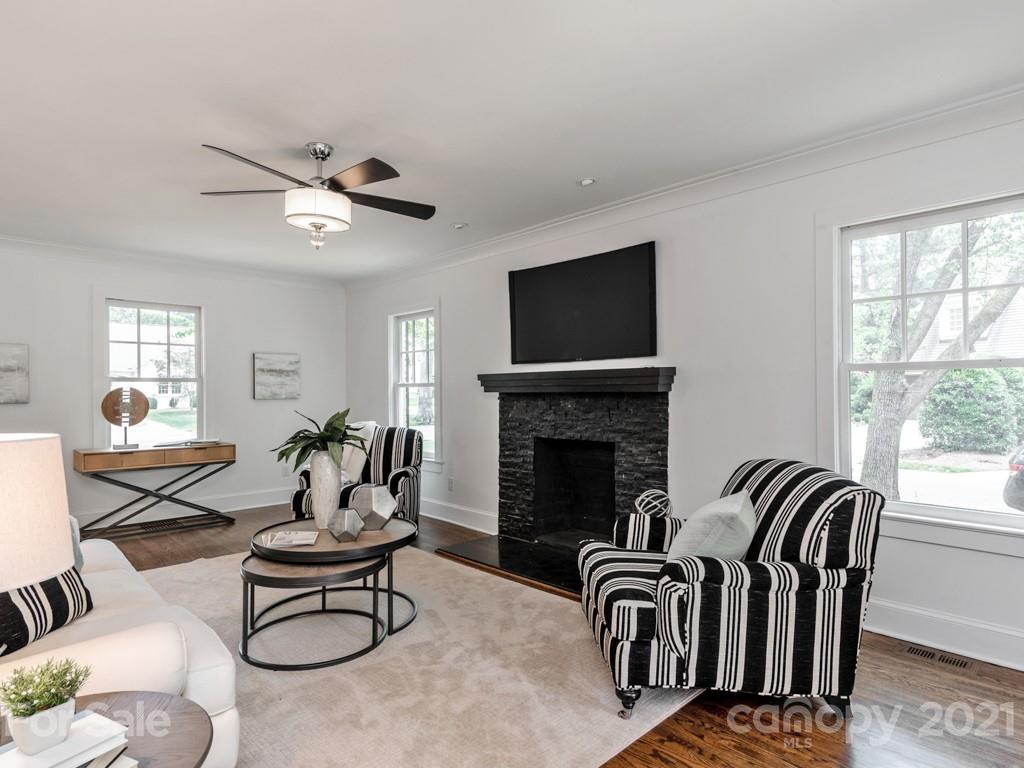 2248 Colony Road Charlotte, NC 28209 - Photo 5 of 27 a living room with furniture and a fireplace