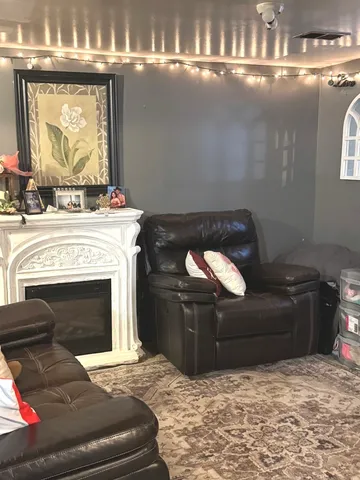a bath room with a shower curtain and a potted plant