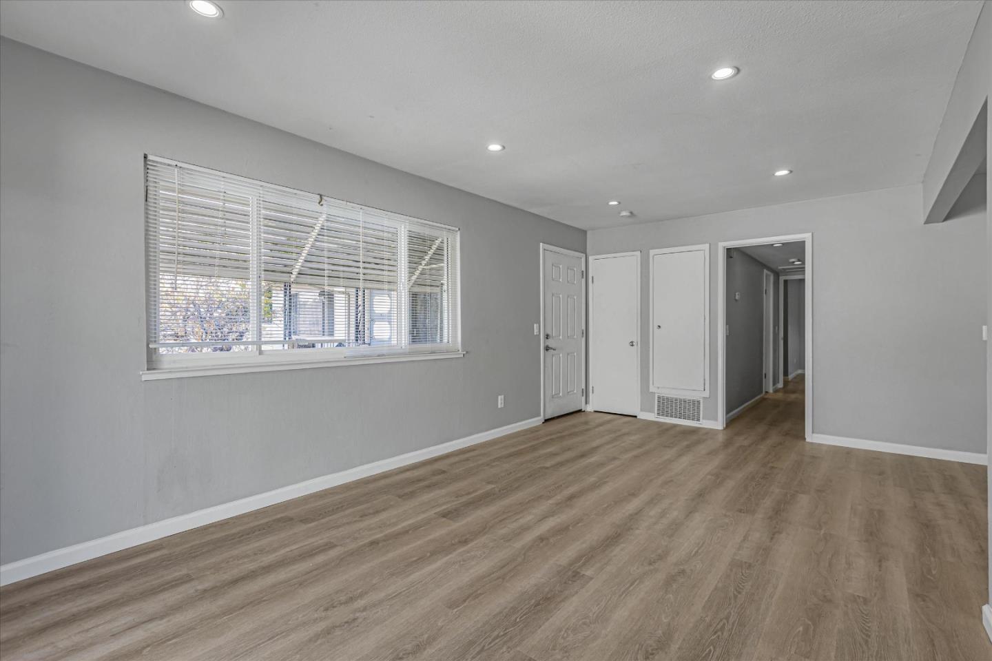 477 Greendale Way San Jose, CA 95129 - Photo 12 of 33 a view of an empty room with wooden floor and a window