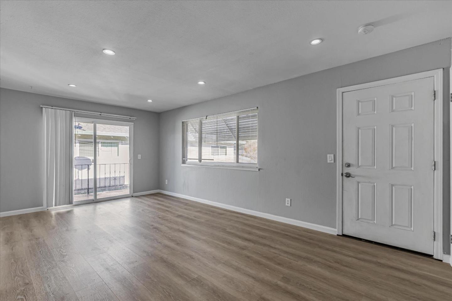 477 Greendale Way San Jose, CA 95129 - Photo 13 of 33 a view of an empty room with wooden floor and a window