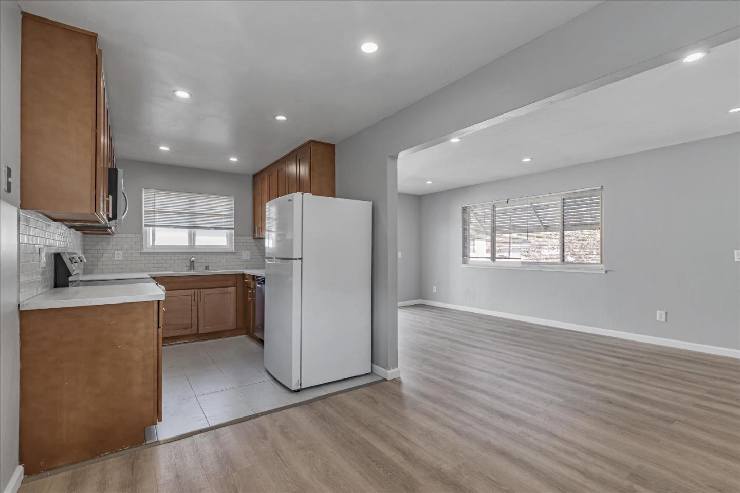 477 Greendale Way San Jose, CA 95129 - Photo 18 of 33 a kitchen with refrigerator and cabinets