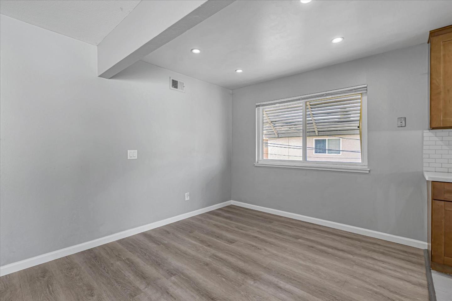 477 Greendale Way San Jose, CA 95129 - Photo 19 of 33 a view of a room with wooden floor and windows